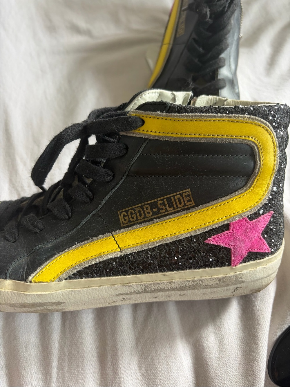 Golden Goose Black High-Top Sneaker with Yellow Stripe and Pink Star